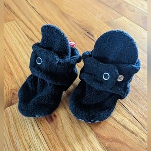 Black Cozie fleece Zutano booties with grippy bottom